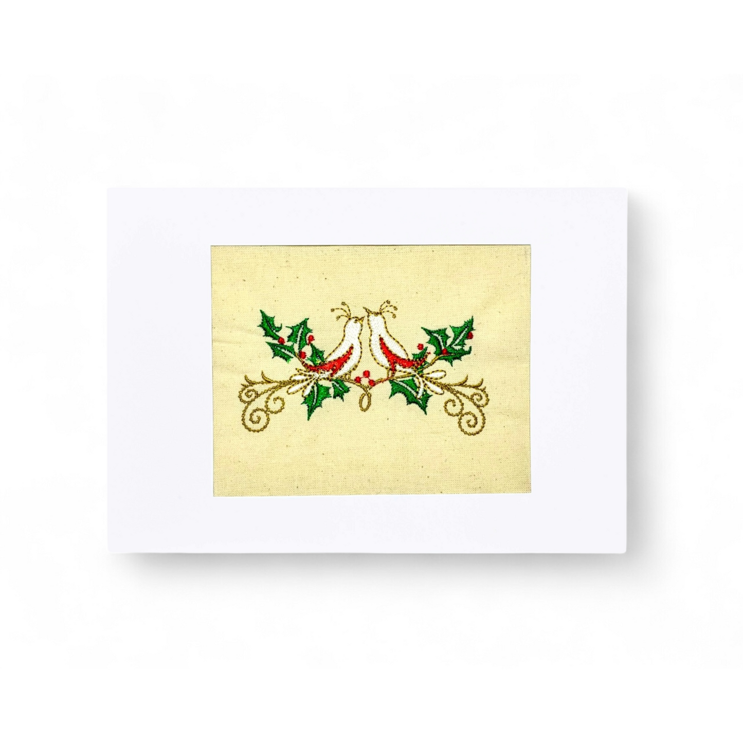 Embroidered turtle doves on a cream background with holly and berries.