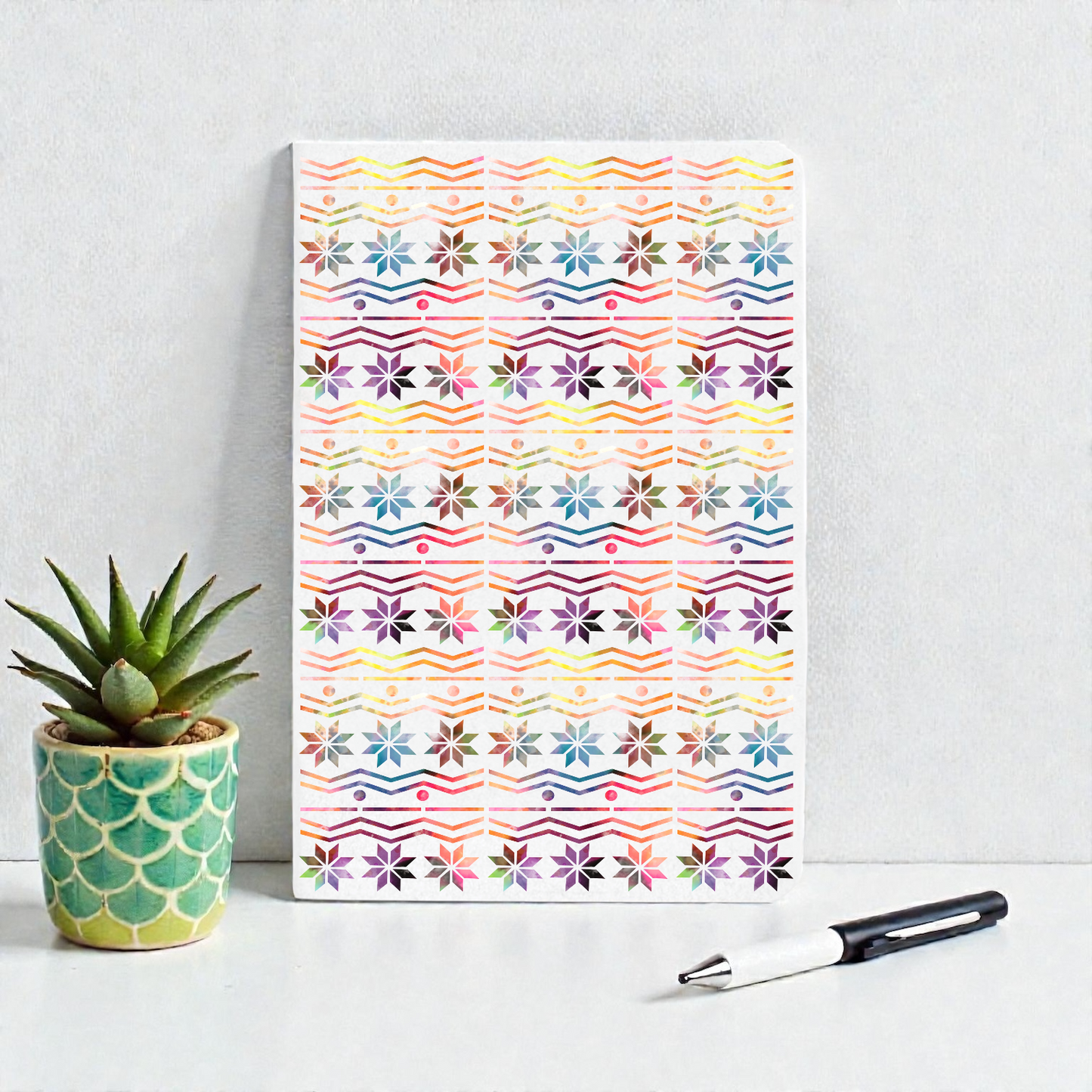 A6 pocket notebook with a rainbow Fair Isle pattern.