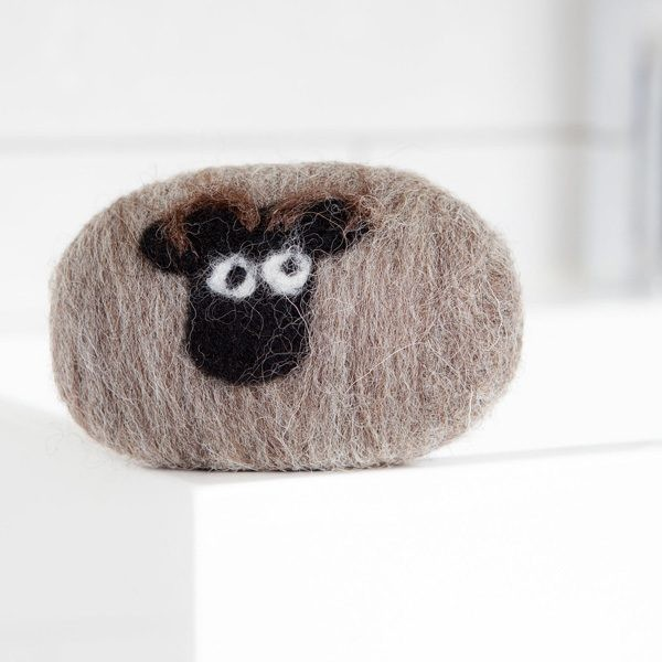 Shetland Sheep hand felted soap with natural wool wrapping.