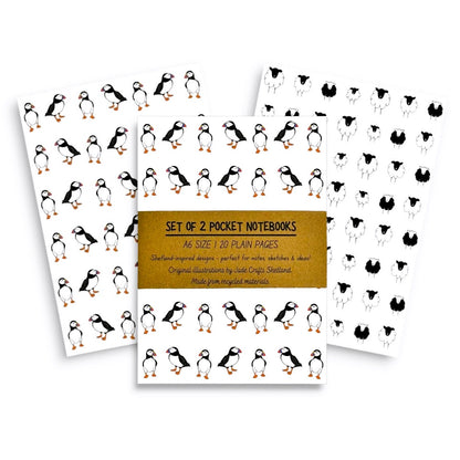 A set of two A6 pocket notebooks featuring illustrated puffin and sheep patterns.