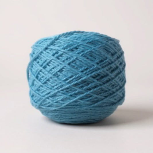 A ball of soft blue yarn with a textured weave.