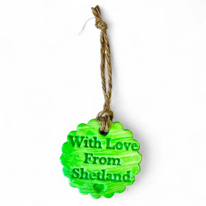 Green scalloped clay ornament with "With Love From Shetland" text.