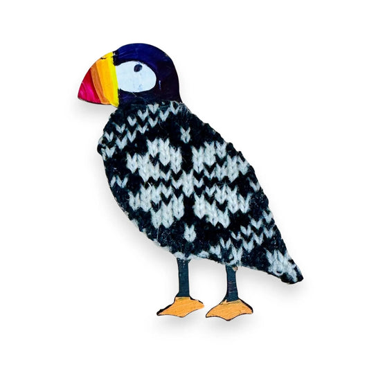 Handmade wooden puffin magnet featuring a black and white knitted wool body and painted beak.