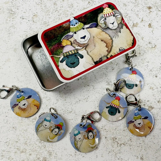 Happy Sheep crochet stitch markers in a pocket tin.