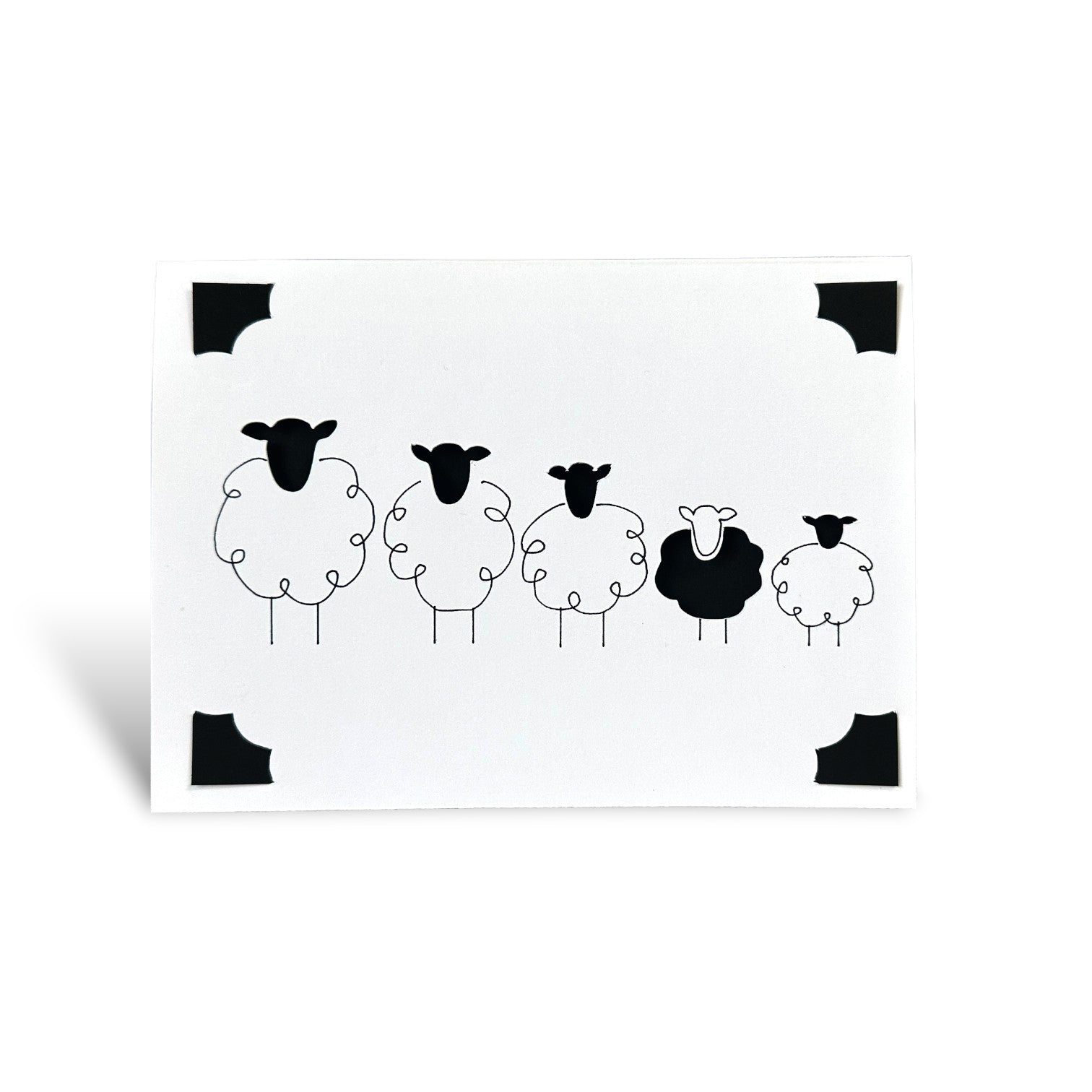 Handmade greeting card featuring a row of five minimalist black and white Shetland sheep.