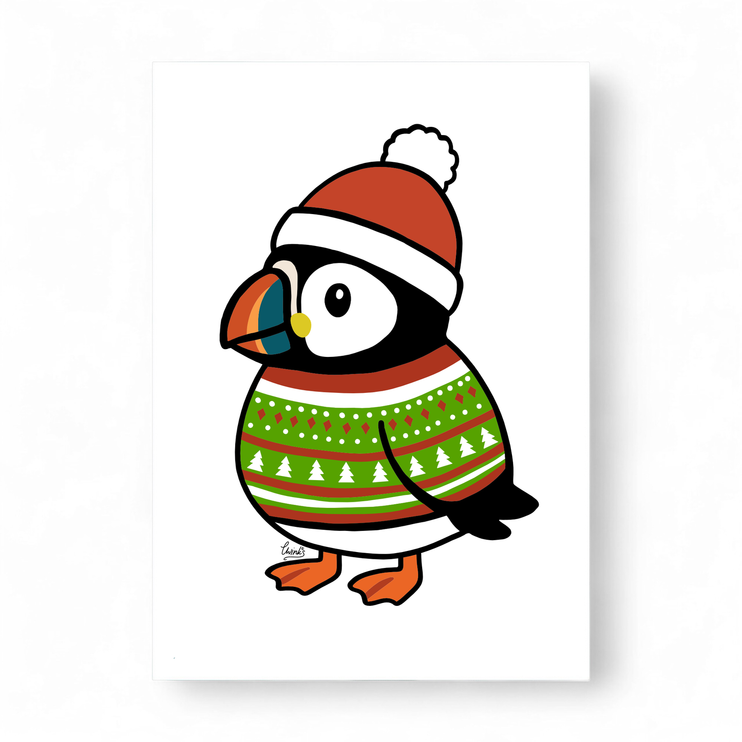 Pete the Puffin wearing a Christmas sweater and hat.