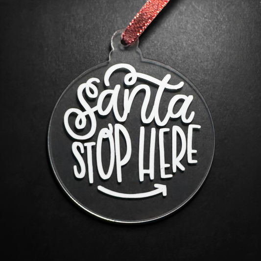 Clear acrylic Christmas ornament with "Santa Stop Here" text.