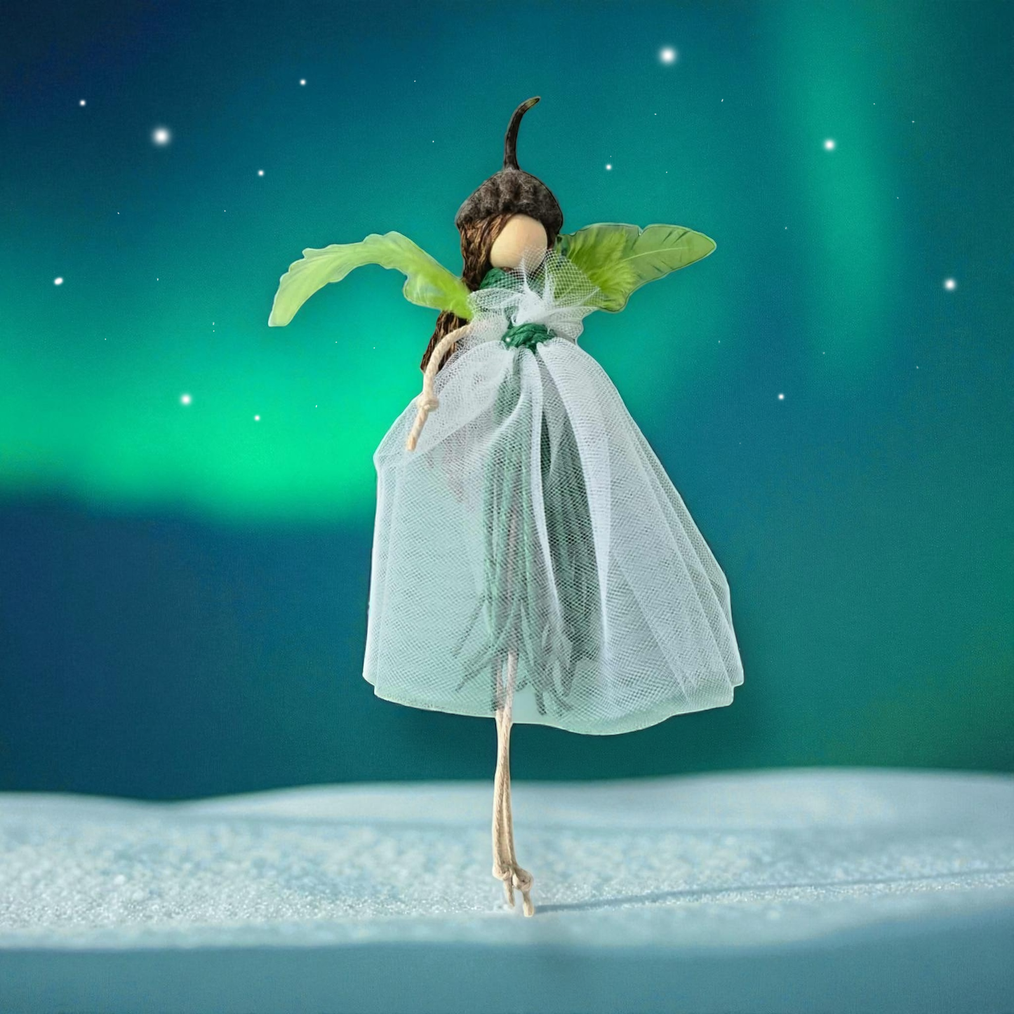 Shetland Macramé Doll with acorn cap and green wings.