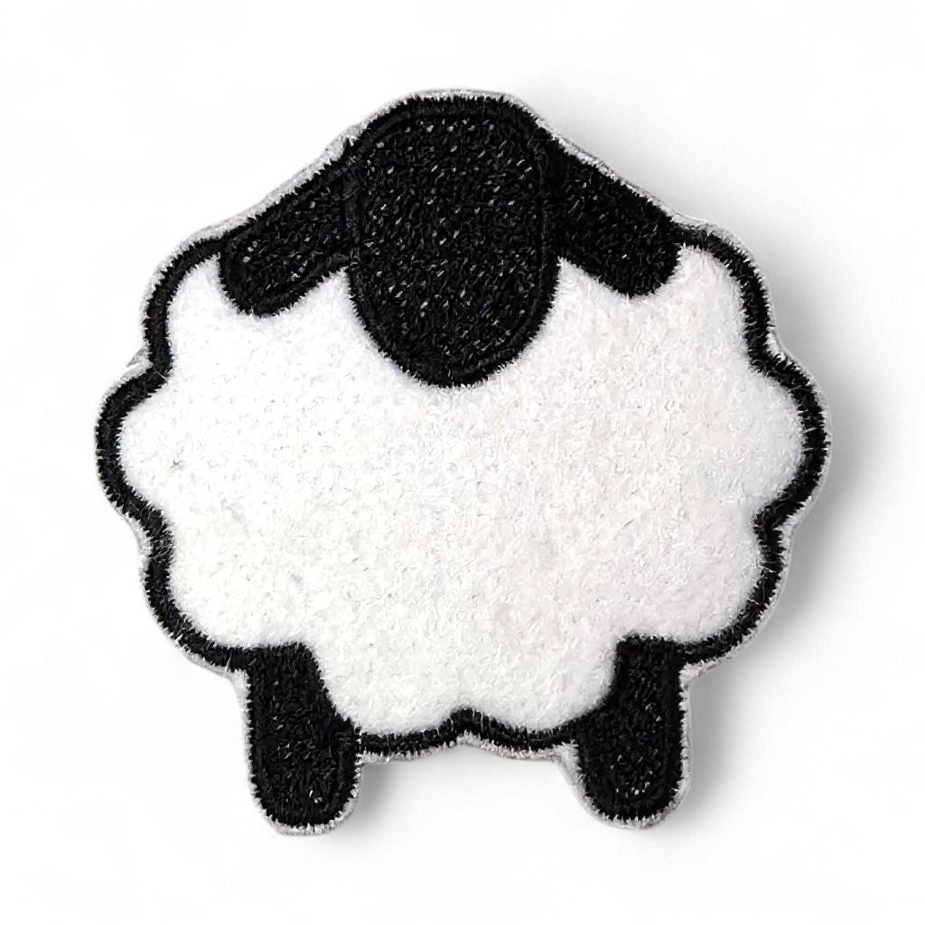 Iron-on embroidered patch of a white sheep with black head and legs.