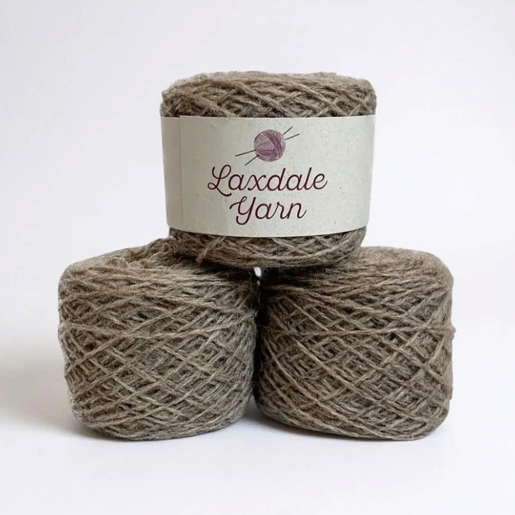 Three skeins of Laxdale Yarn Natural Fawn 100% Shetland wool.