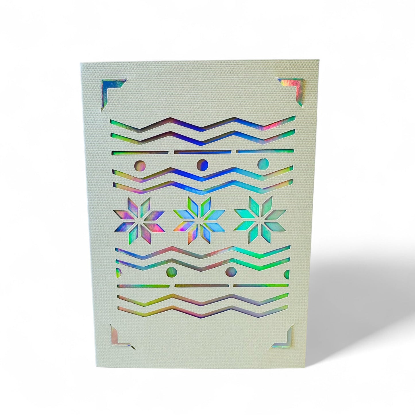 Handmade Fair Isle card with green and holographic cutouts.
