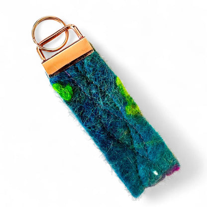 Handmade felt keyring inspired by the Northern Lights in blue and green.