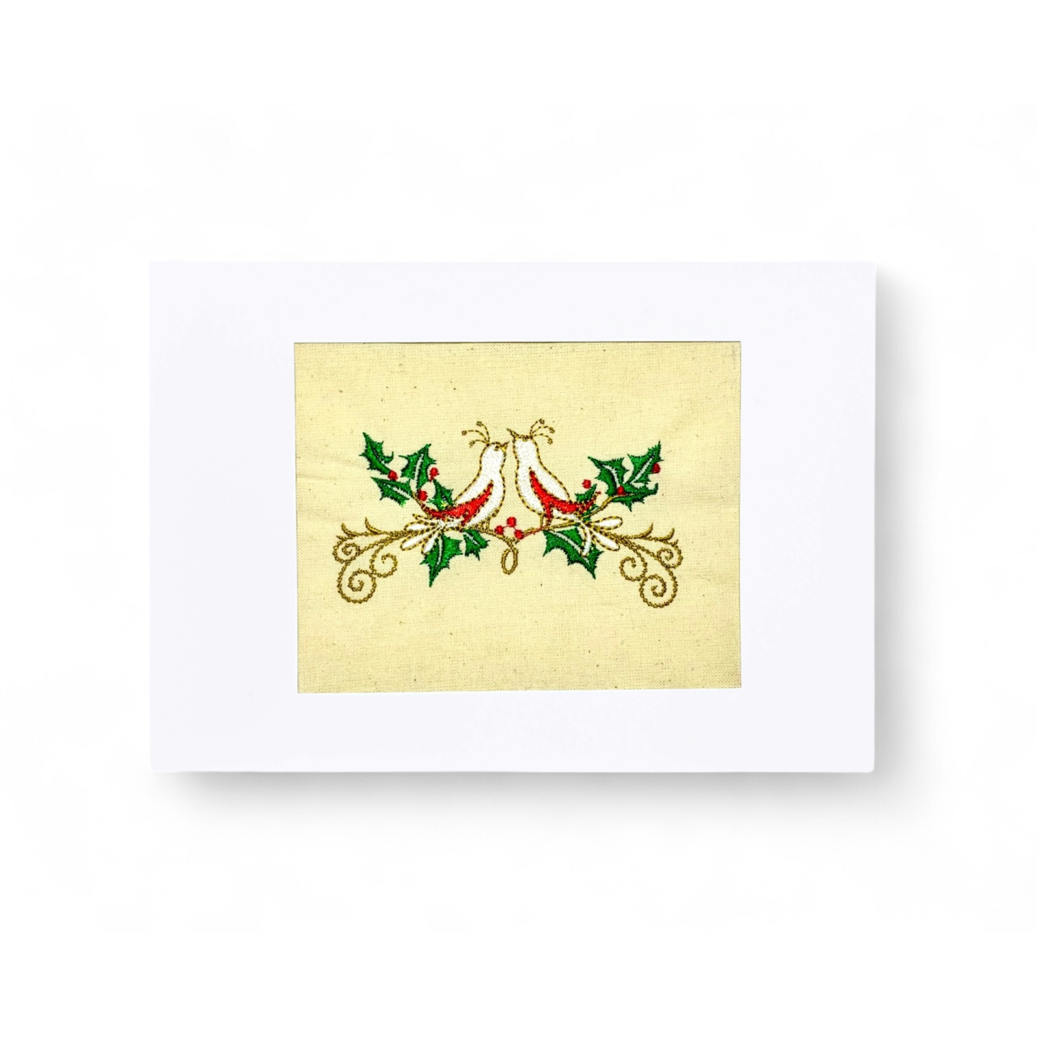 Embroidered turtle doves on a cream background with holly and berries.