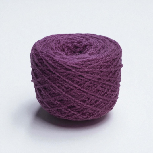 A ball of rich purple wool yarn on a white background.