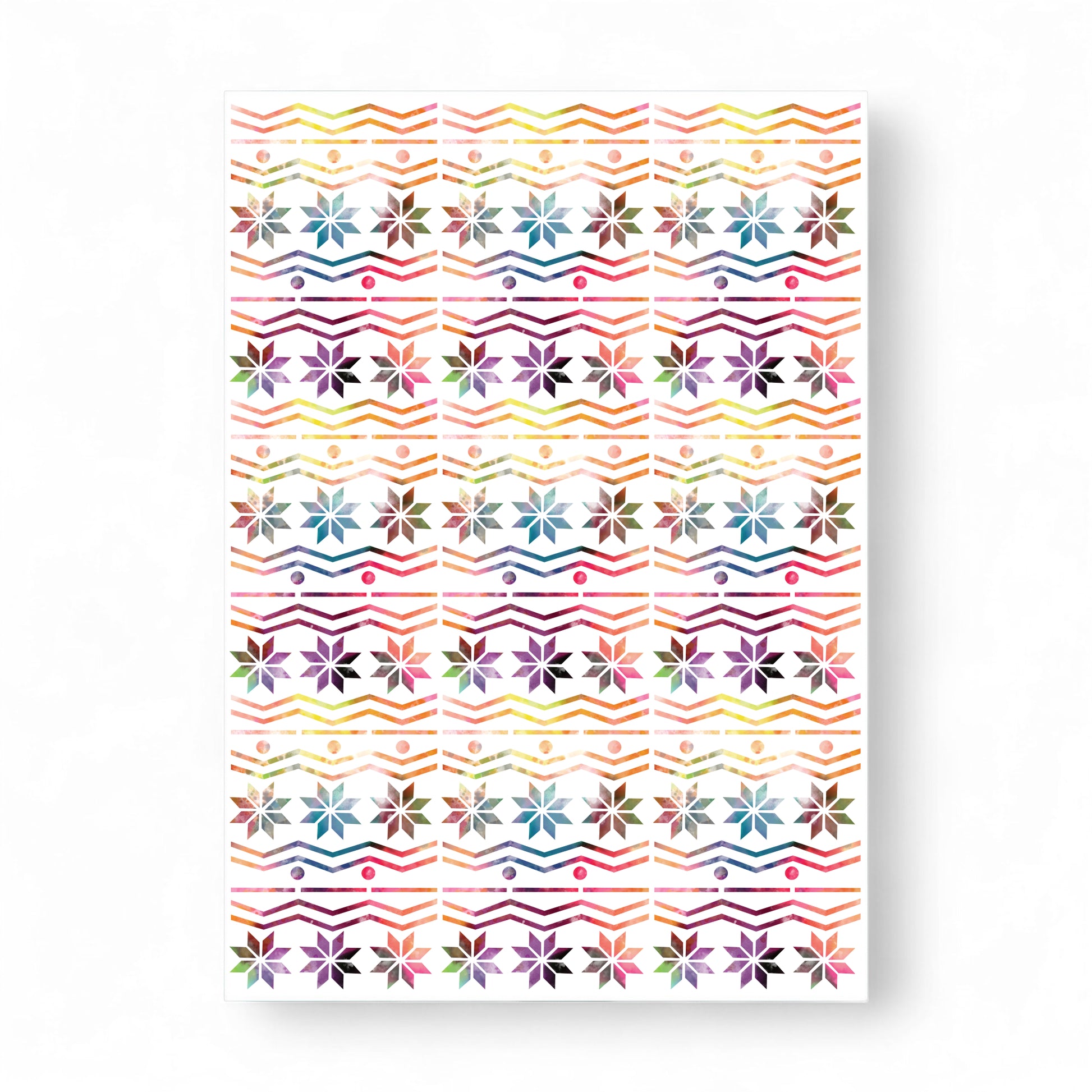 Printed rainbow Fair Isle card with snowflake and zigzag patterns.