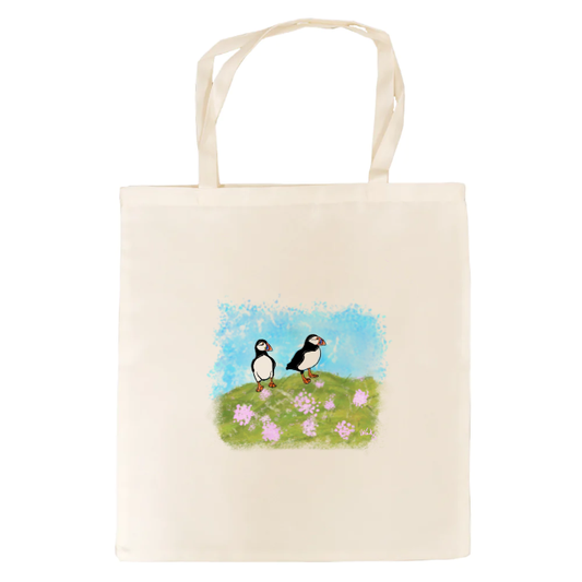 Puffin printed tote bag with two puffins on a grassy hill.
