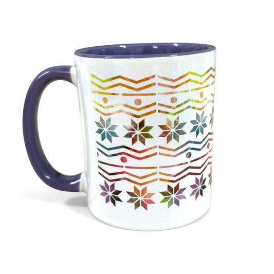 White ceramic mug with a purple handle and interior, featuring a colorful Fair Isle pattern.