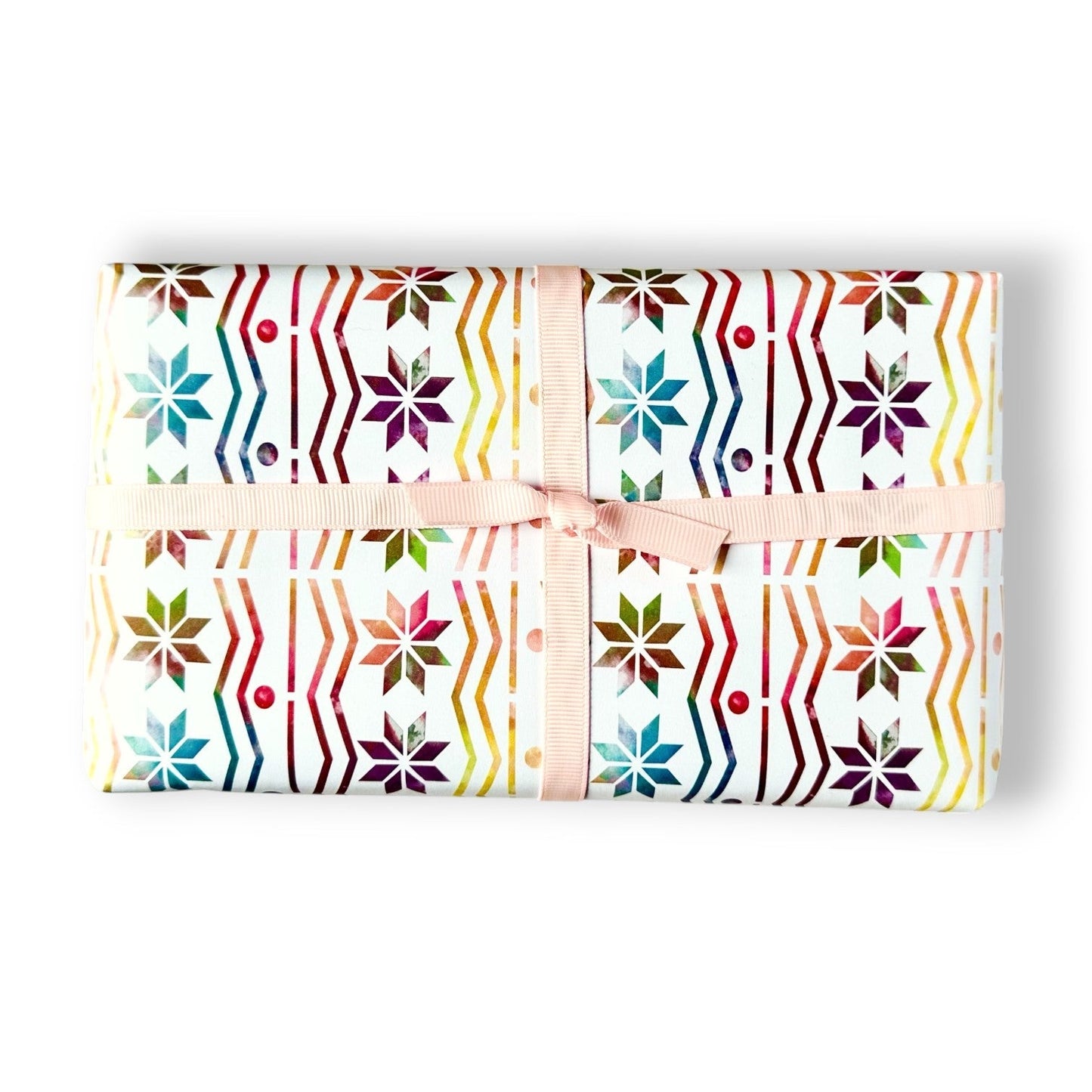 Rainbow Fair Isle wrapping paper with a pink ribbon.
