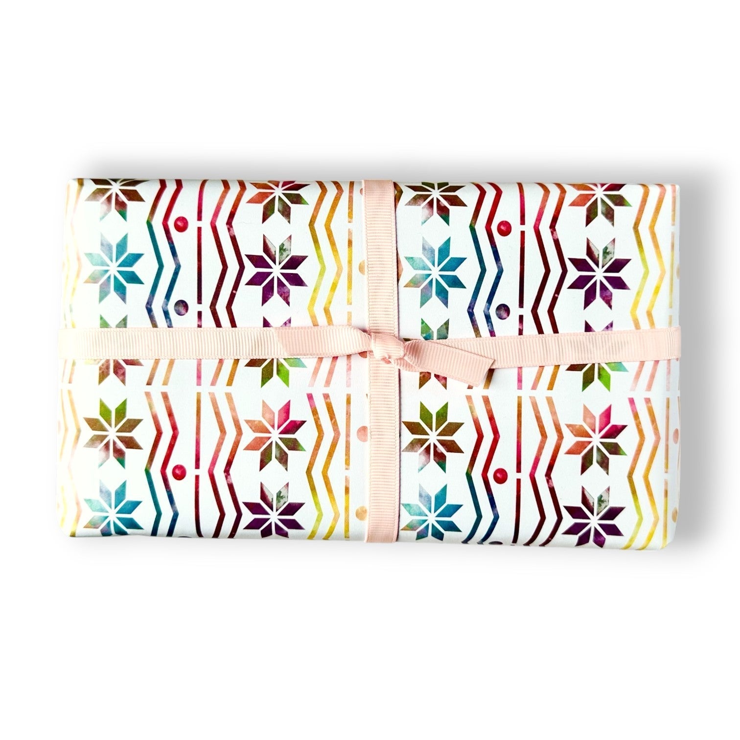 Rainbow Fair Isle wrapping paper with a pink ribbon.