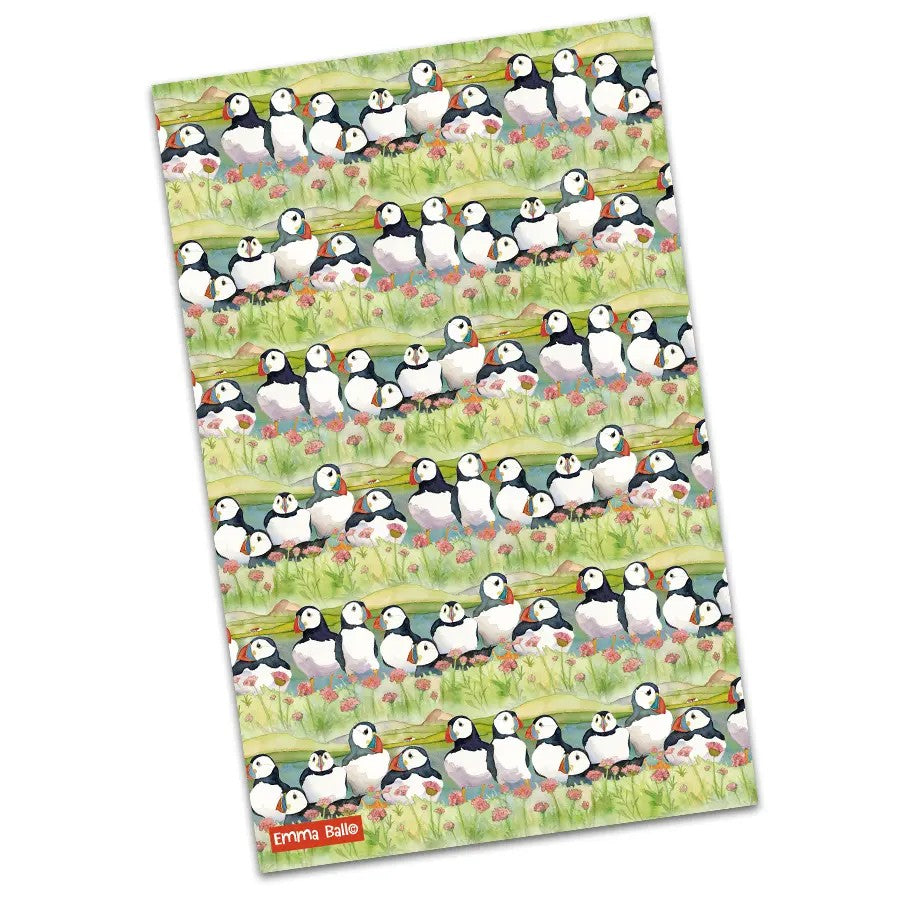Sea Thrift Puffins tea towel featuring a repeating pattern of puffins and sea thrift flowers.