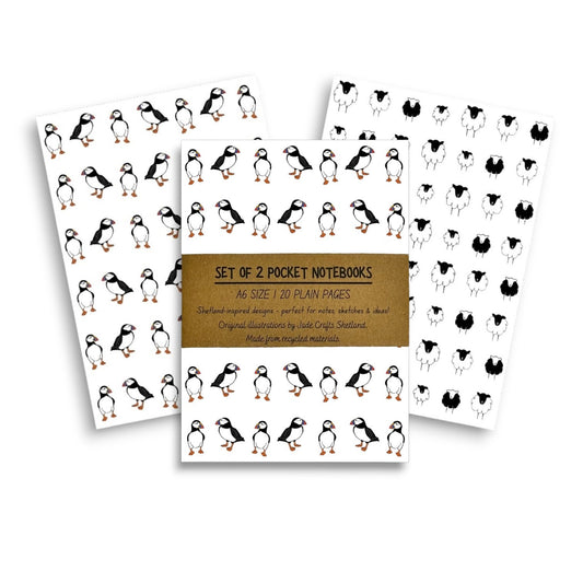 Set of two A6 notebooks with puffin and sheep designs.