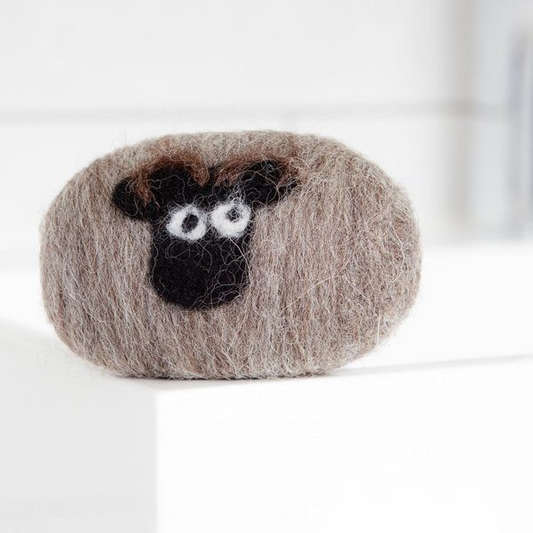 Shetland Sheep hand felted soap with natural wool wrapping.