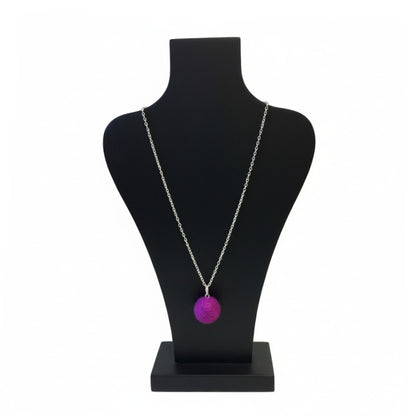 Hand felted purple wool ball pendant on a silver plated chain displayed on a black bust.