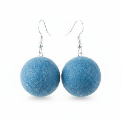 A pair of blue hand-felted wool ball earrings with silver-colored metal hooks.