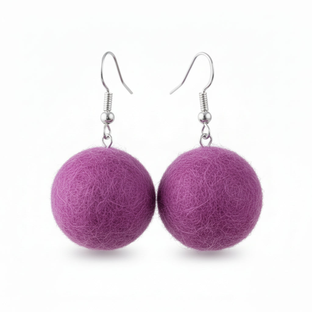 A pair of purple hand-felted wool ball earrings with silver-colored fishhook ear wires.