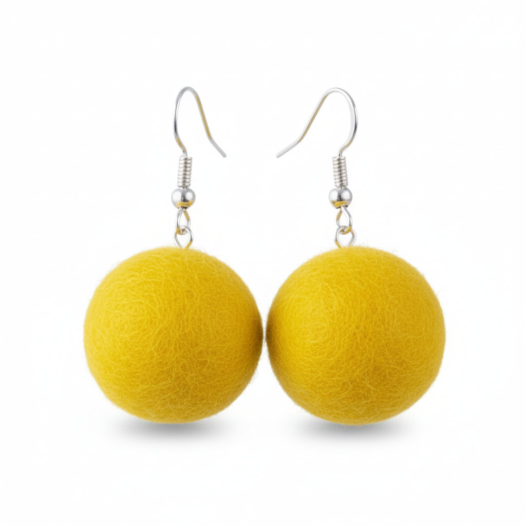 A pair of yellow hand-felted wool ball earrings with silver-colored fishhook ear wires.