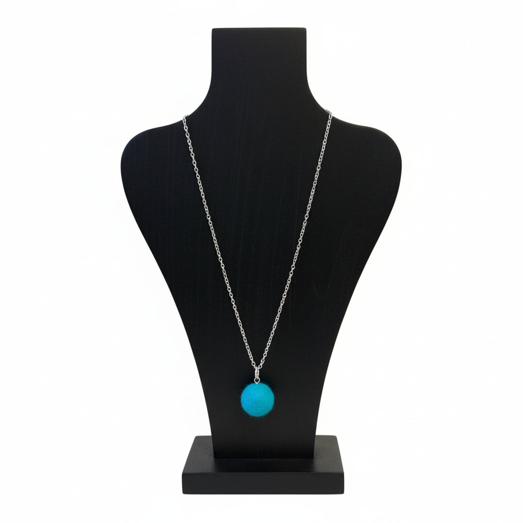 Hand felted wool necklace with a bright blue pendant on a silver-plated chain.
